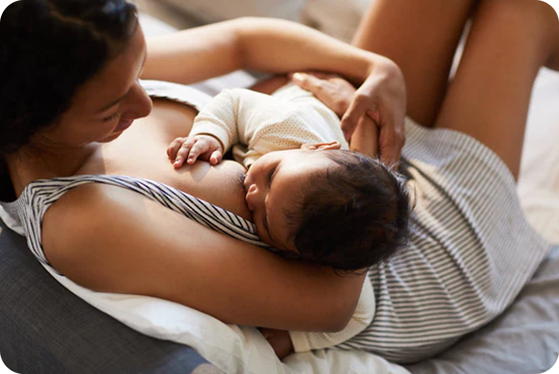 Mother holding baby and breastfeeding