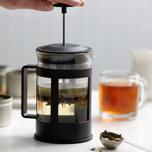 French Press Tea Infuser - Apothecary This black features a clear glass carafe and plastic handle. It brews loose leaf